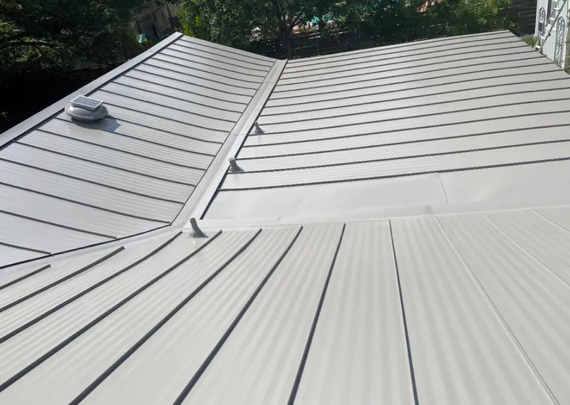 Solar attic fan installed on a metal roof for Roof Ventilation in Plumas Lake